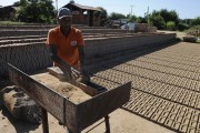 Man manually producing bricks in pottery - Jose Bonifacio city - Sao Paulo state (SP) - Brazil