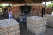 Stacked bricks and oven used for burning bricks in the background - Jose Bonifacio city - Sao Paulo state (SP) - Brazil