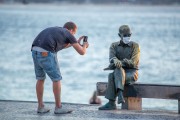 Man photographing the statue of the poet Carlos Drummond de Andrade with protective mask against Covid 19 - Rio de Janeiro city - Rio de Janeiro state (RJ) - Brazil