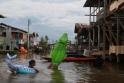 City of Anama during flooding of the Solimoes River - Children using buoys - Anama city - Amazonas state (AM) - Brazil