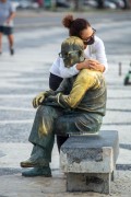 Woman hugging the statue of the poet Carlos Drummond de Andrade on Copacabana Beach - Rio de Janeiro city - Rio de Janeiro state (RJ) - Brazil