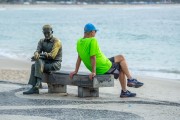 Man sitting on the bench next to the statue of the poet Carlos Drummond de Andrade - Rio de Janeiro city - Rio de Janeiro state (RJ) - Brazil