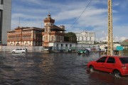 Cars passing through flooded street in the historic center of Manaus during the biggest flood of the Rio Negro since the beginning of records in 1902 - Manaus city - Amazonas state (AM) - Brazil