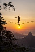 Practitioner of slackline on the top of Rock of Gavea - Sao Conrado and Two Brothers Mountain in the background  - Rio de Janeiro city - Rio de Janeiro state (RJ) - Brazil
