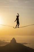 Practitioner of slackline on the top of Rock of Gavea - Two Brothers Mountain in the background  - Rio de Janeiro city - Rio de Janeiro state (RJ) - Brazil