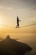 Practitioner of slackline on the top of Rock of Gavea - Two Brothers Mountain in the background  - Rio de Janeiro city - Rio de Janeiro state (RJ) - Brazil