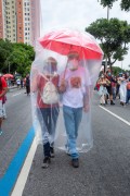 Couple with umbrella and plastic cover to protect against Covid 19 - June 19 demonstration against the government of President Jair Messias Bolsonaro - Rio de Janeiro city - Rio de Janeiro state (RJ) - Brazil