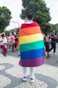 Man wrapped in flag with the colors of the Rainbow, symbol of the LGBTQIA+ movement - Demonstration in opposition to the government of President Jair Messias Bolsonaro - Rio de Janeiro city - Rio de Janeiro state (RJ) - Brazil