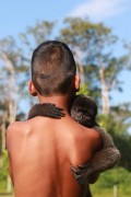 Child with a Wooly Monkey (Lagothrix lagotricha) - Mamiraua Sustainable Development Reserve - Uarini city - Amazonas state (AM) - Brazil