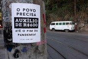 Poster pasted on a pole encouraging the payment of emergency aid - Coronavirus Crisis - Rio de Janeiro city - Rio de Janeiro state (RJ) - Brazil