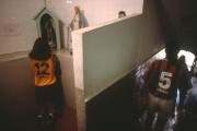 Player of the Fluminense Football Club womens soccer team praying at furnished altar, provided in the clubs locker room - Rio de Janeiro city - Rio de Janeiro state (RJ) - Brazil