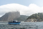 Fishing boat in Guanabara Bay with the Sugarloaf in the background  - Rio de Janeiro city - Rio de Janeiro state (RJ) - Brazil