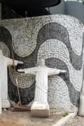 Small replicas of the statue of Christ the Redeemer and portuguese stone wall in a gas station with a traditional wave design of the Copacabana boardwalk - Rio de Janeiro city - Rio de Janeiro state (RJ) - Brazil