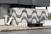 Small replicas of the statue of Christ the Redeemer and portuguese stone wall in a gas station with a traditional wave design of the Copacabana boardwalk - Rio de Janeiro city - Rio de Janeiro state (RJ) - Brazil