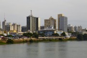 Paraiba do Sul River with buildings in the background - Campos dos Goytacazes city - Rio de Janeiro state (RJ) - Brazil