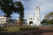 Childrens playground and church on Nossa Senhora da Boa Morte Square - Sao Joao da Barra city - Rio de Janeiro state (RJ) - Brazil