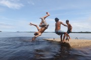 Children playing in the Negro River - Novo Airao city - Amazonas state (AM) - Brazil