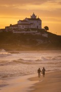 Sunset at Itauna Beach with Our Lady of Nazareth Church (1837) in the background - Saquarema city - Rio de Janeiro state (RJ) - Brazil