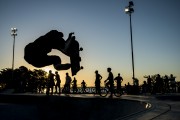 Skateboarder doing maneuvers on the largest skate park in Latin America on the banks of the Guaiba River at sunset - Porto Alegre city - Rio Grande do Sul state (RS) - Brazil