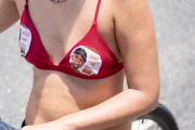 Woman with Union of Blacks and Blacks for Equality (Unegro) sticker on bikini asking for justice for Moise - Demonstration in repudiation of the murder of Congolese refugee Moise Kabagambe near Post 8 - Rio de Janeiro city - Rio de Janeiro state (RJ) - Brazil