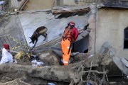 Firefighter searching for bodies in Morro da Oficina with the help of dog Bono after landslides and flooding caused by heavy rains - Petropolis city - Rio de Janeiro state (RJ) - Brazil