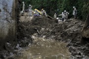Firefighter searching for bodies in Morro da Oficina after landslides and flooding caused by heavy rains - Petropolis city - Rio de Janeiro state (RJ) - Brazil