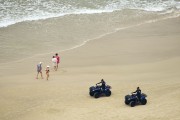 Police officers on ATV doing security at Pitangueiras Beach - Guaruja city - Sao Paulo state (SP) - Brazil