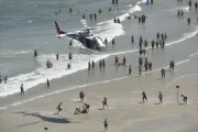 Military Police helicopter in a bather rescue operation in Pitangueiras Beach - Guaruja city - Sao Paulo state (SP) - Brazil