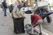 Recyclable pickers collecting objects on the sidewalk - Sao Paulo city - Sao Paulo state (SP) - Brazil