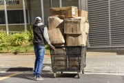 Delivery man pushing cart - Sao Paulo city - Sao Paulo state (SP) - Brazil