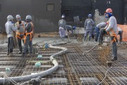 Workers filling the slab of a building under construction with concrete in Vila Romana - Workers wearing a mask due to the coronavirus pandemic - Sao Paulo city - Sao Paulo state (SP) - Brazil