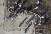 Picture taken with drone of the workers filling the slab of a building under construction with concrete in Vila Romana - Workers wearing a mask due to the coronavirus pandemic - Sao Paulo city - Sao Paulo state (SP) - Brazil