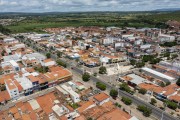 Picture taken with drone of the Santos Dumont highway ( BR-116) crossing the city - Dionisio Rocha Lucena Square on the right and countryside in the background - Brejo Santo city - Ceara state (CE) - Brazil