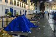 Homeless people sleeping on the floor of Patio do Colegio (Courtyard of the College) - 1554 - landmark the foundation of Sao Paulo city, on the coldest day of the year - Sao Paulo city - Sao Paulo state (SP) - Brazil