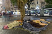 Homeless people sleeping on the floor of the Se Square, on the coldest day of the year - Sao Paulo city - Sao Paulo state (SP) - Brazil