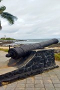 Cannon of Santa Maria Fort (1696) with Barra Lighthouse in the background  - Salvador city - Bahia state (BA) - Brazil