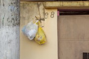 Organic garbage bags hanging on the facade of the house - Guarani city - Minas Gerais state (MG) - Brazil