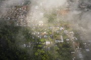 Picture taken with drone of the Amazon rainforest and the city of Novo Airao under clouds - Novo Airao city - Amazonas state (AM) - Brazil