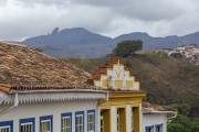 Facade of colonial houses with Itacolomi Paek in the background - Ouro Preto city - Minas Gerais state (MG) - Brazil