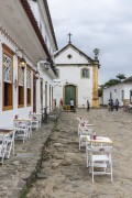 Facade of historic houses - Paraty historic center - with the Our Lady of the Rosary of the Black Men and Sao Benedito Church (1725) in the background - Paraty city - Rio de Janeiro state (RJ) - Brazil