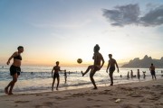 Bathers playing soccer - Arpoador Beach waterfront with the Morro Dois Irmaos (Two Brothers Mountain) in the background  - Rio de Janeiro city - Rio de Janeiro state (RJ) - Brazil