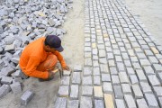 Workers paving with paving stones at the redevelopment work on the Maranguapinho River - Fortaleza city - Ceara state (CE) - Brazil