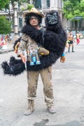 Man dressed (Fantasy Gorilla Hunter) - carnival street troup parade - Rio de Janeiro city - Rio de Janeiro state (RJ) - Brazil
