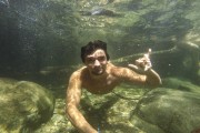 Man swimming underwater with selfie stick - Serrinha do Alambari Environmental Protection Area - Resende city - Rio de Janeiro state (RJ) - Brazil