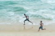Young people running on Arpoador Beach - Rio de Janeiro city - Rio de Janeiro state (RJ) - Brazil