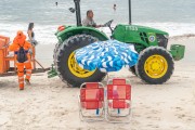 Garis from COMLURB (urban cleaning company of Rio de Janeiro city) using a tractor to clean Copacabana Beach - Rio de Janeiro city - Rio de Janeiro state (RJ) - Brazil