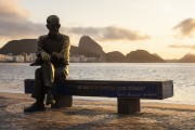 View of the statue of poet Carlos Drummond de Andrade on Post 6 during the dawn with the Sugarloaf in the background  - Rio de Janeiro city - Rio de Janeiro state (RJ) - Brazil