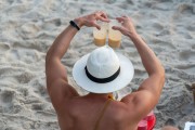 Man wearing a hat preparing caipirinhas - Arpoador Beach - Rio de Janeiro city - Rio de Janeiro state (RJ) - Brazil