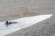 Child playing in puddle of water on Ipanema Beach - Rio de Janeiro city - Rio de Janeiro state (RJ) - Brazil