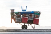 Detail of cargo trolley - man carrying a cart - with beach chairs - Copacabana Beach waterfront - Rio de Janeiro city - Rio de Janeiro state (RJ) - Brazil